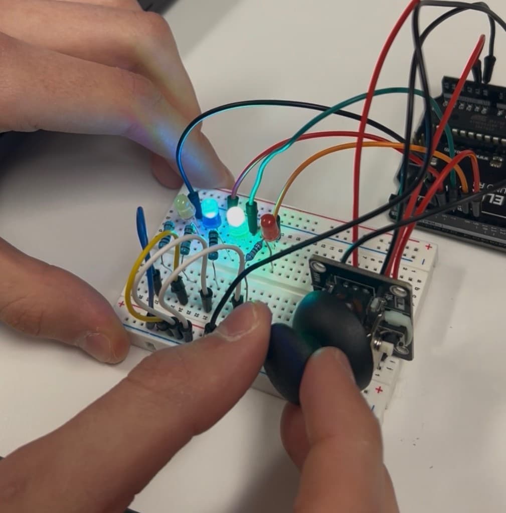 Joystick controlling LEDs with three LEDs illuminated